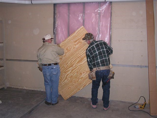 At a JSRH work session on Feb 14, 2005 we covered the window openings with plywood. This completes the sealing of the room from the outside. 