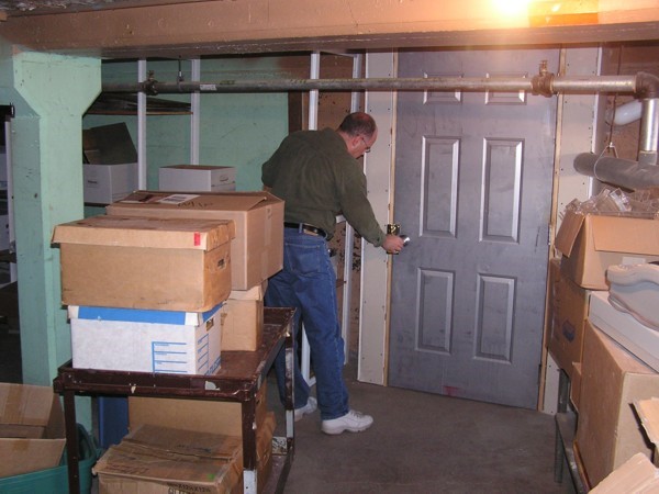 Jim Dick stores the many documents, books and photos in the temperature controlled storage room.
