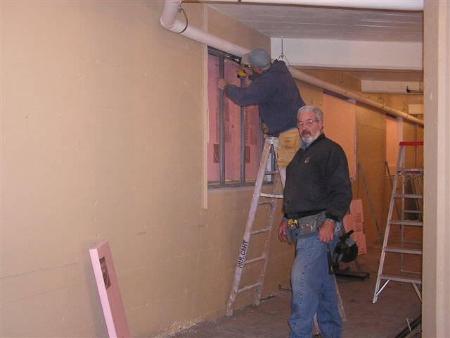 Doug and Ed Ursem complete the framing of the windows.